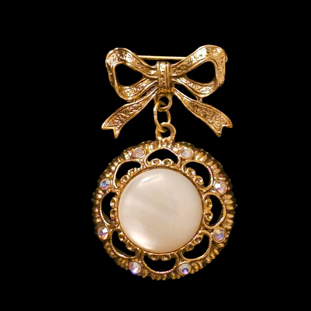 Vintage 1928 Gold Tone Bow Brooch White Stone